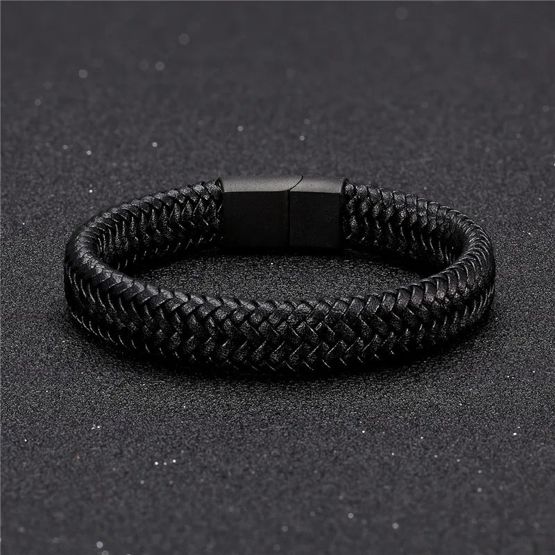 Black braided bracelet on a black textured background