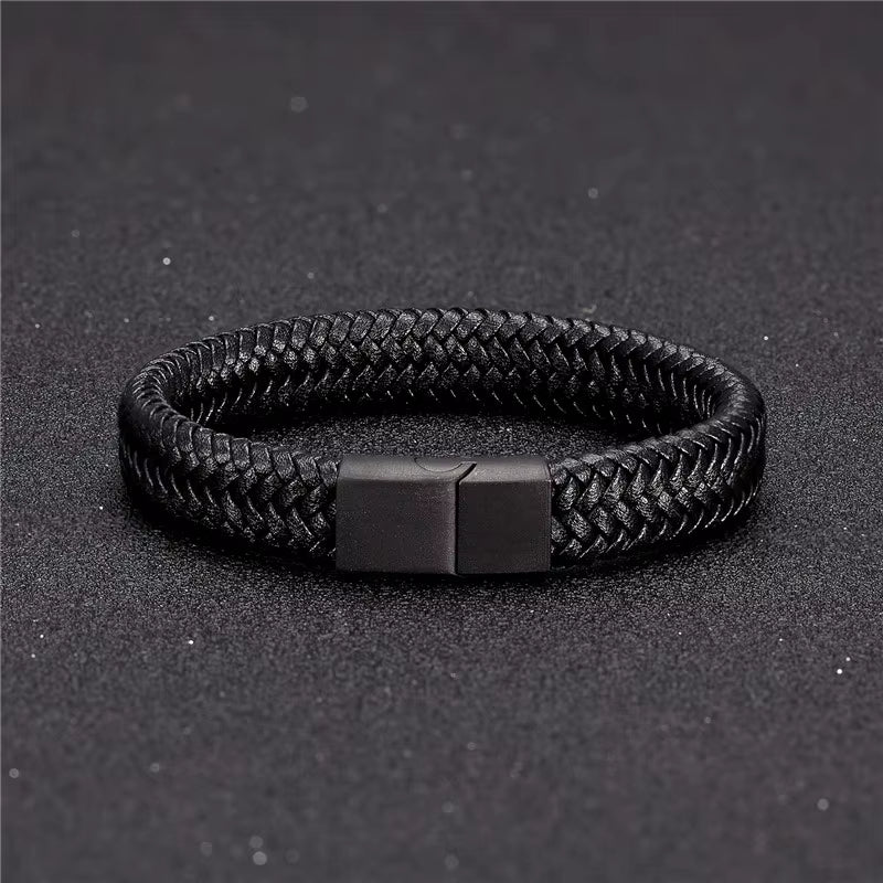 Black braided bracelet with a magnetic clasp on a dark background
