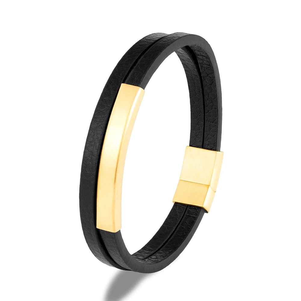 Black rubber bracelet with gold accents on a white background