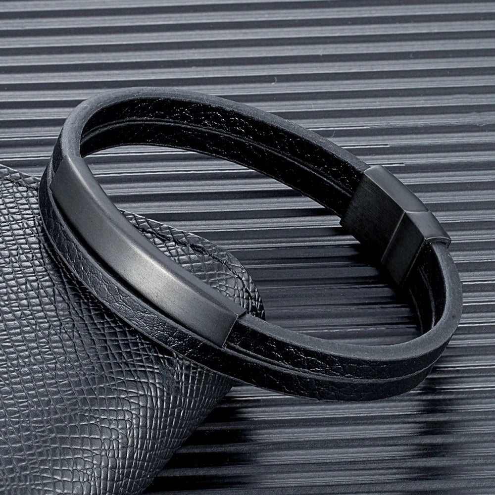 Black leather keychain on a textured surface