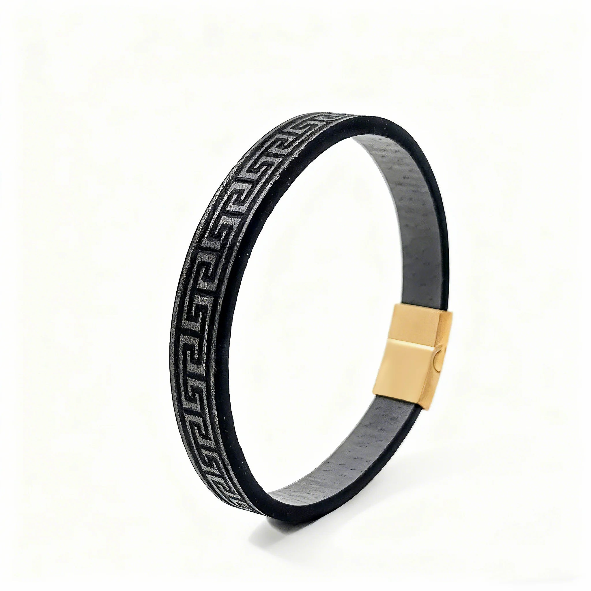 Black rubber bracelet with gold clasp on a white background
