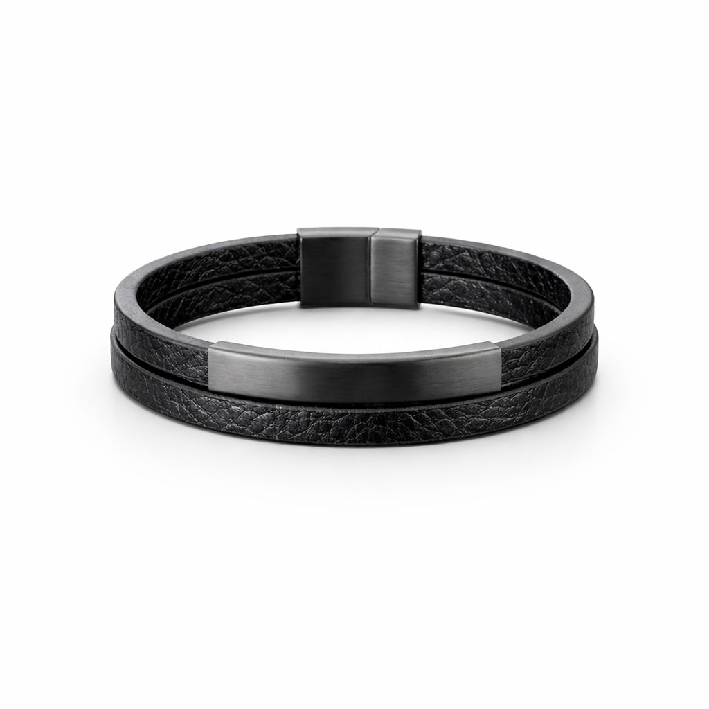 Black leather bracelet with metallic clasp on a white background